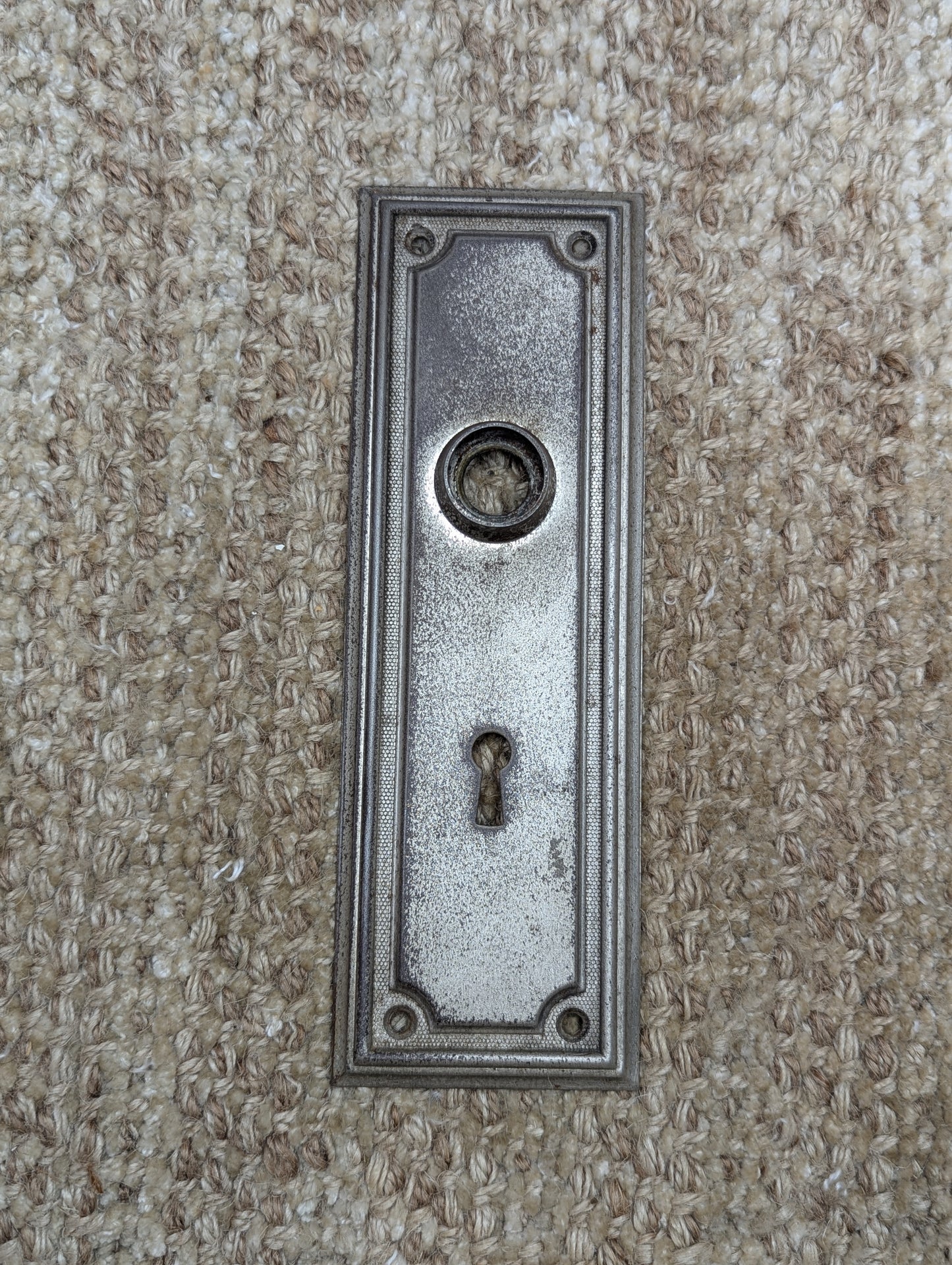 2 3/8" x 7 1/4" Antique Stamped Steel Door Knob Plate