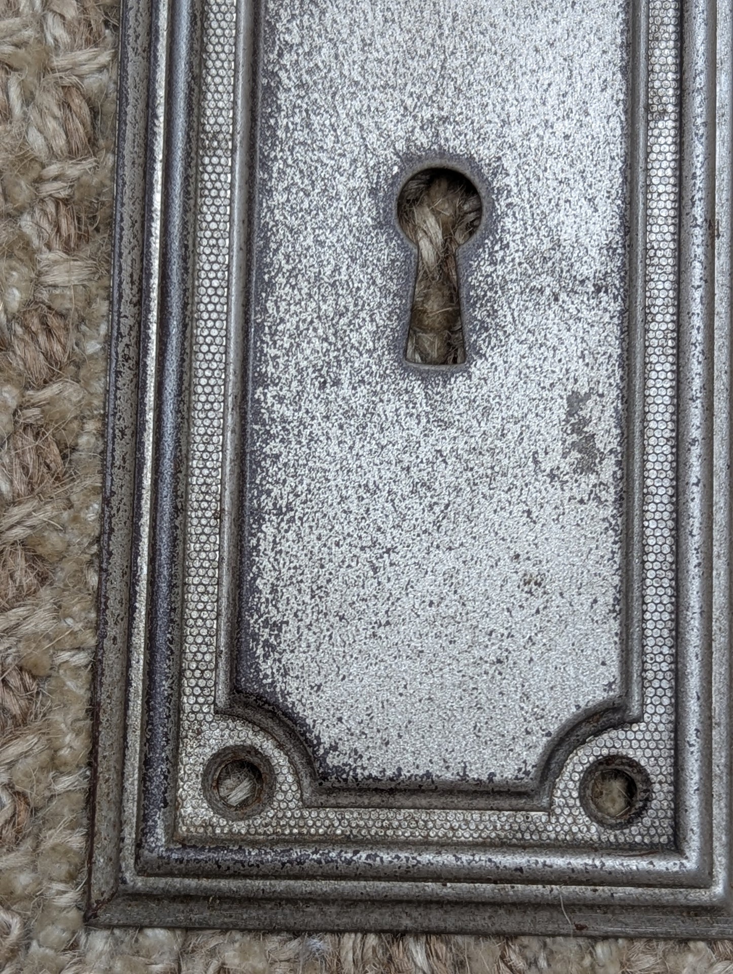 2 3/8" x 7 1/4" Antique Stamped Steel Door Knob Plate