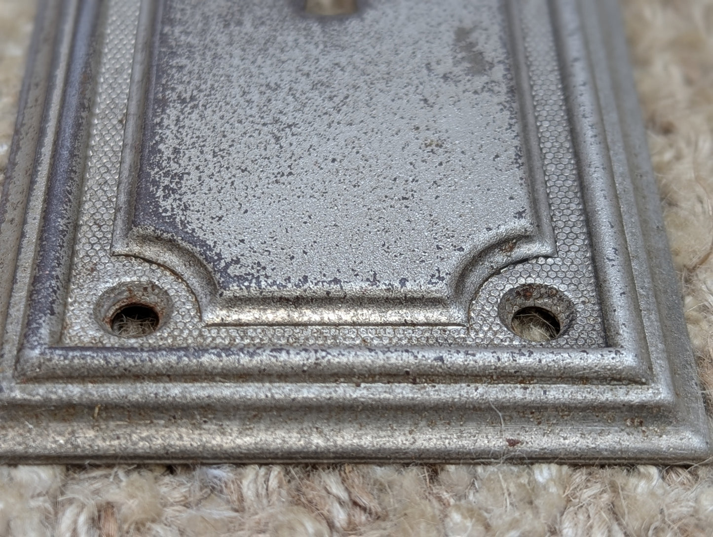 2 3/8" x 7 1/4" Antique Stamped Steel Door Knob Plate