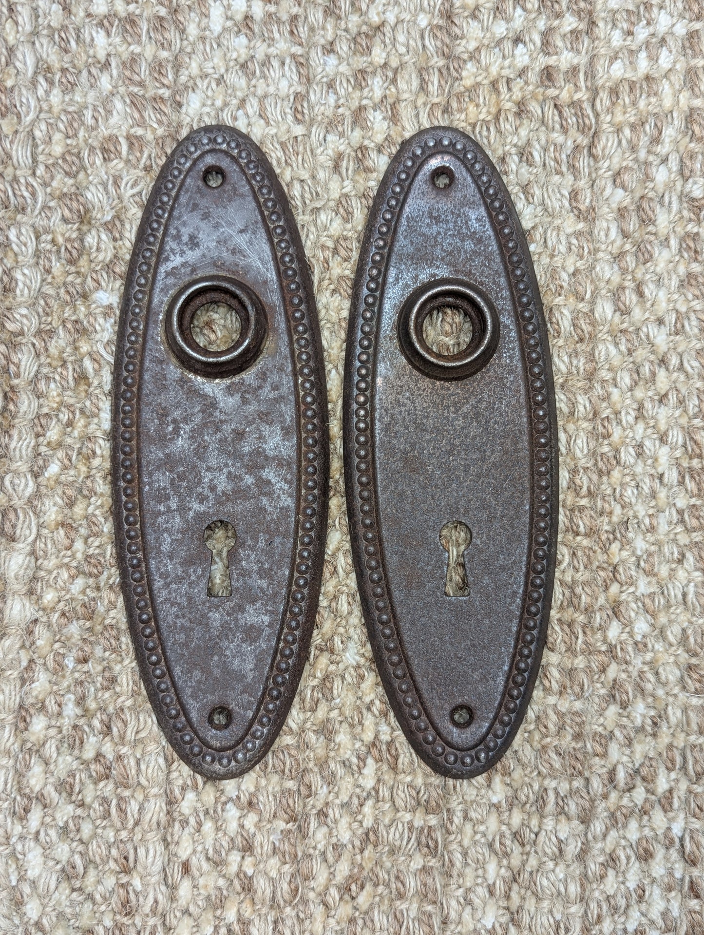 Pair Of 2 1/4" x 6 3/4" Antique Stamped Steel Door Knob Plates