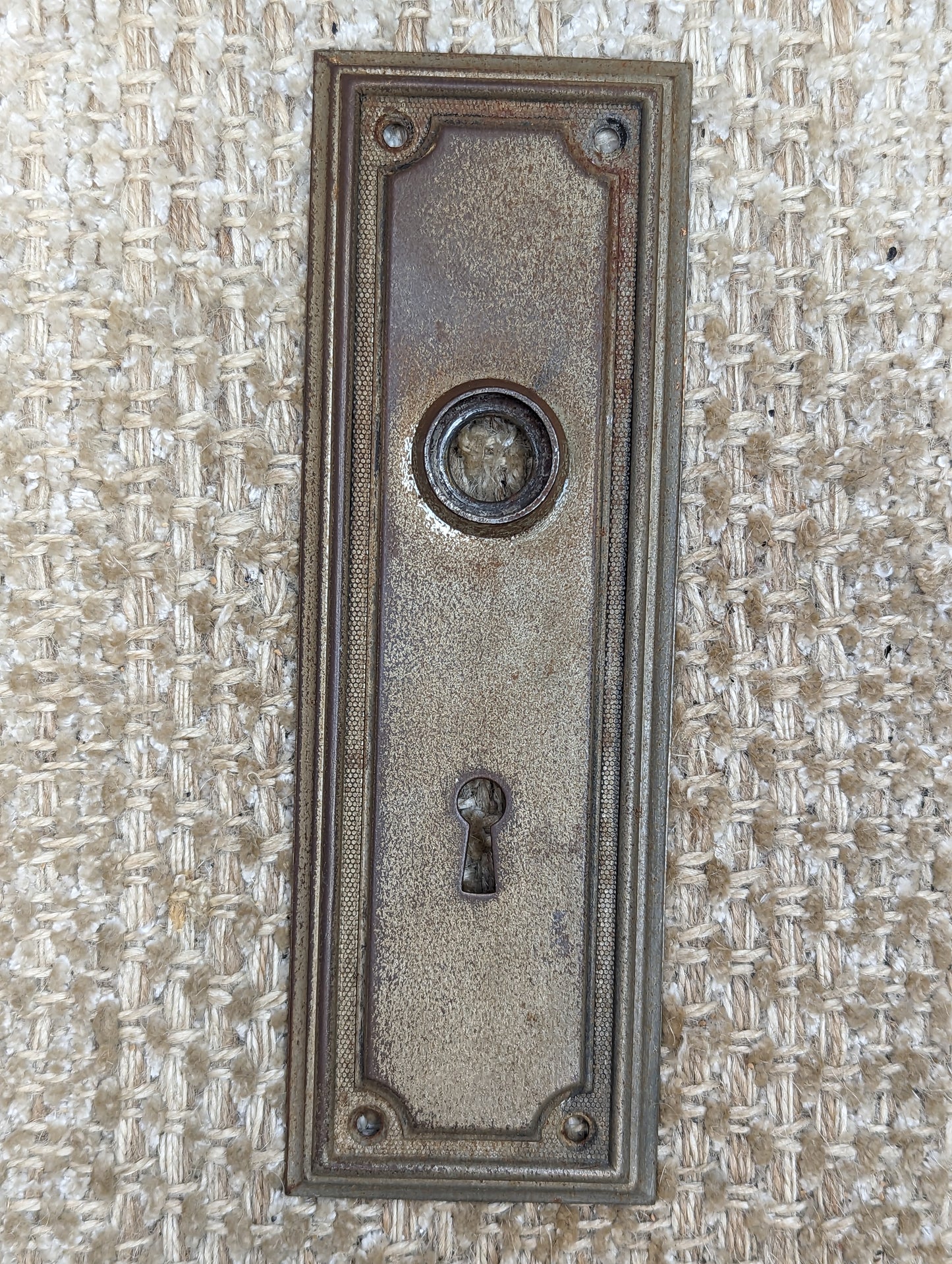 2 3/8" x 7 1/4" Antique Stamped Steel Door Knob Plate