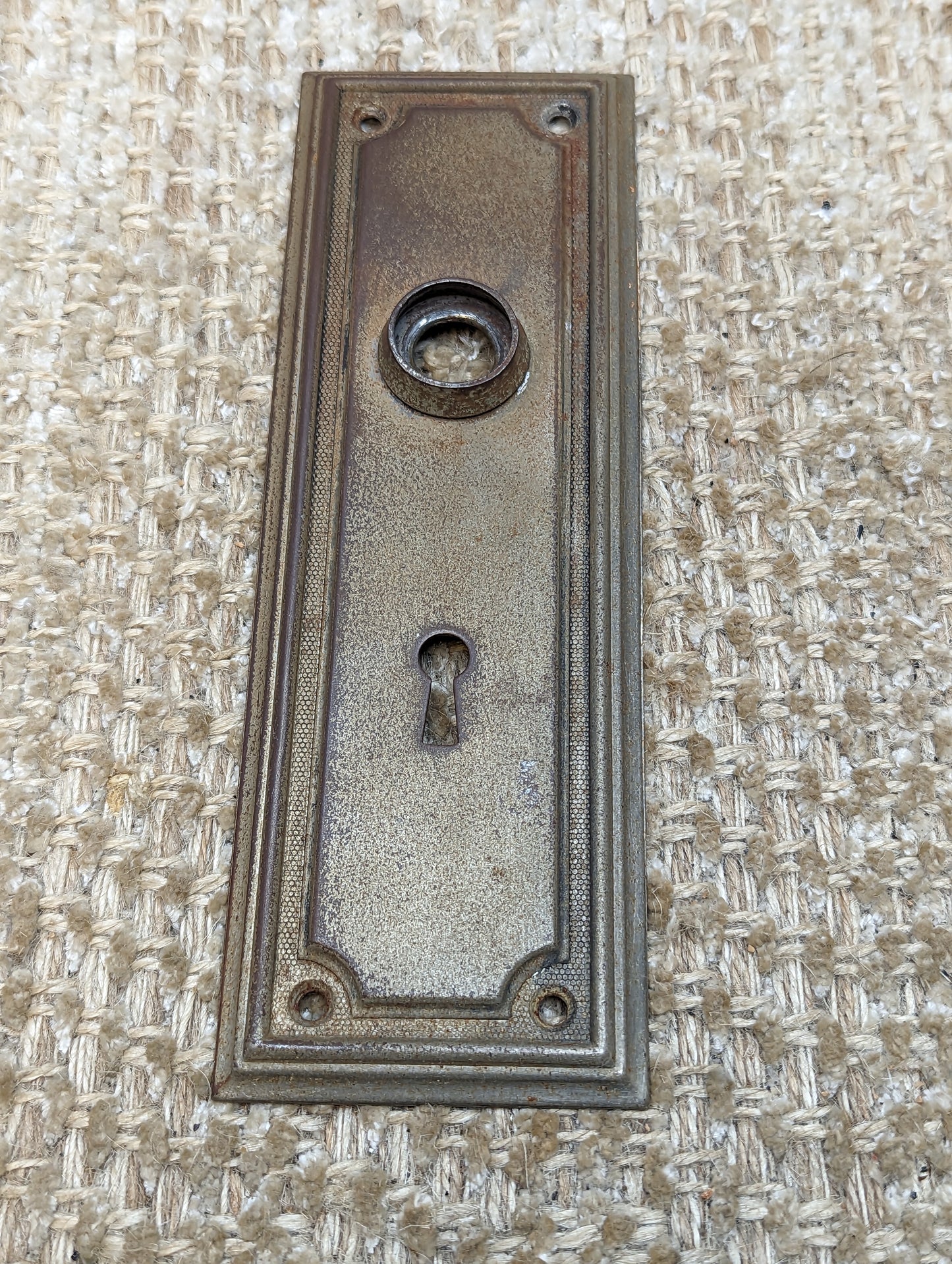 2 3/8" x 7 1/4" Antique Stamped Steel Door Knob Plate