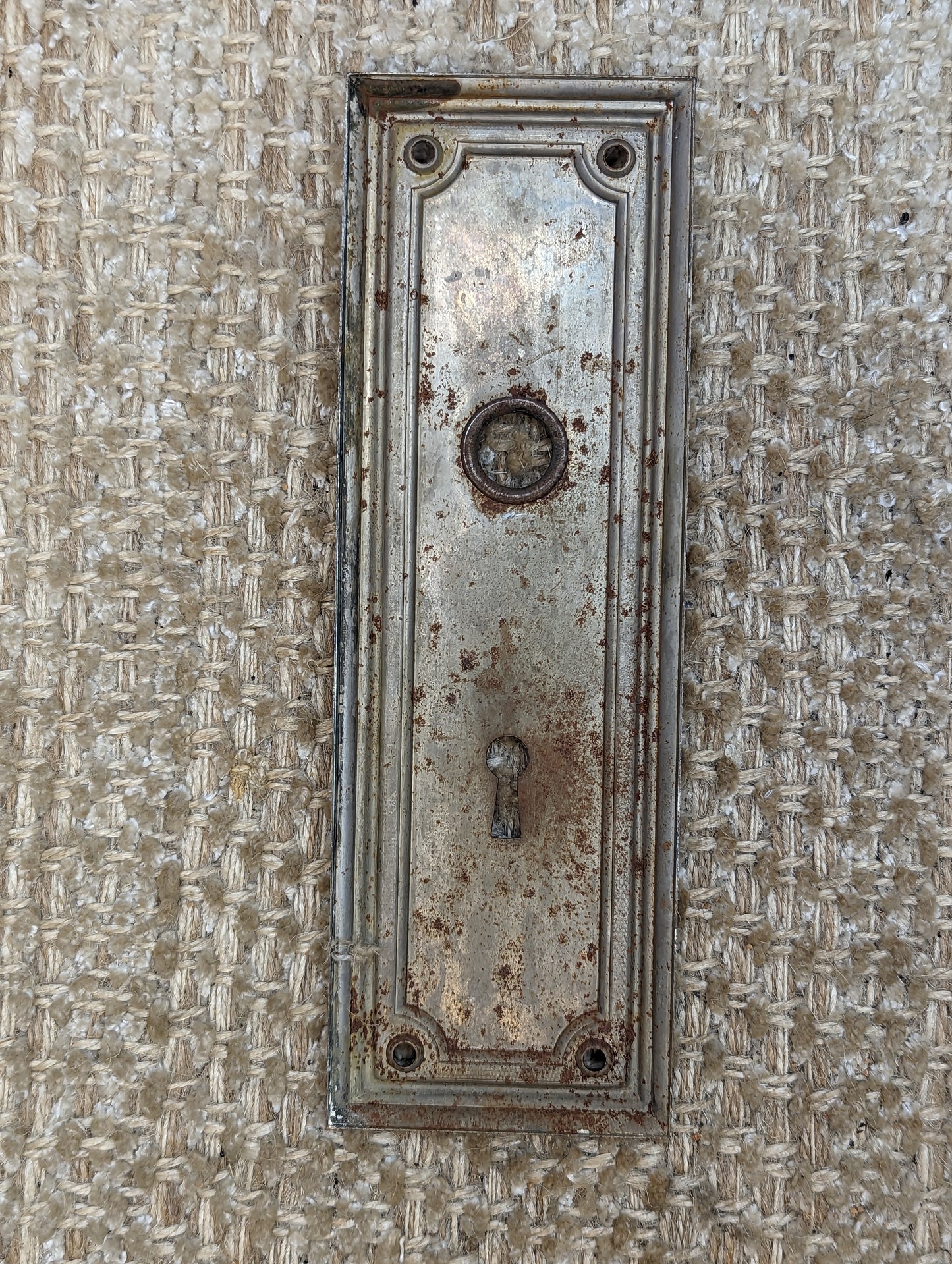 2 3/8" x 7 1/4" Antique Stamped Steel Door Knob Plate