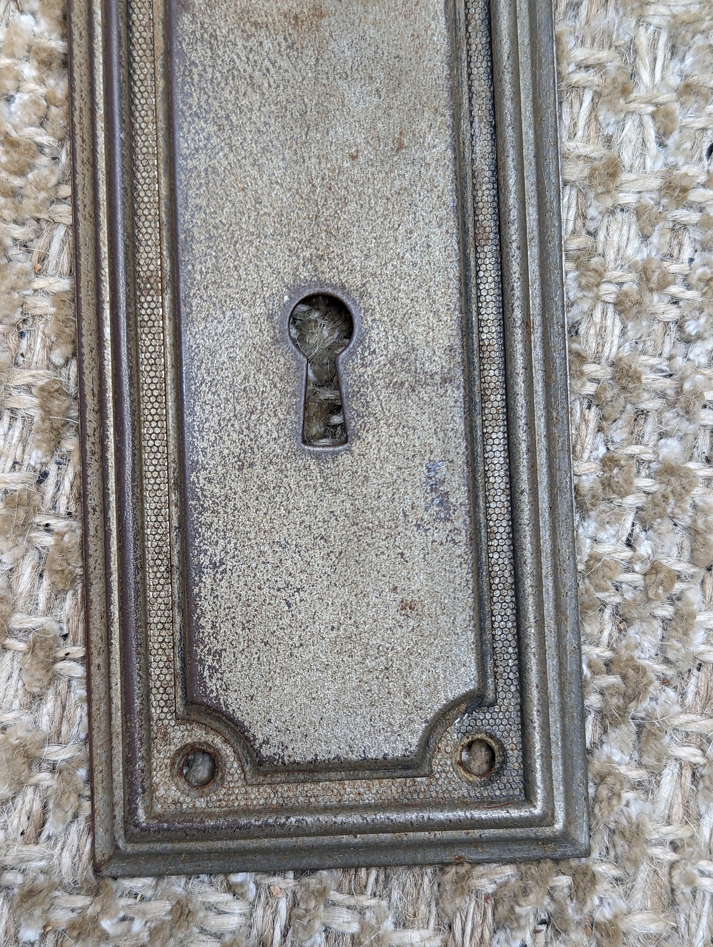 2 3/8" x 7 1/4" Antique Stamped Steel Door Knob Plate