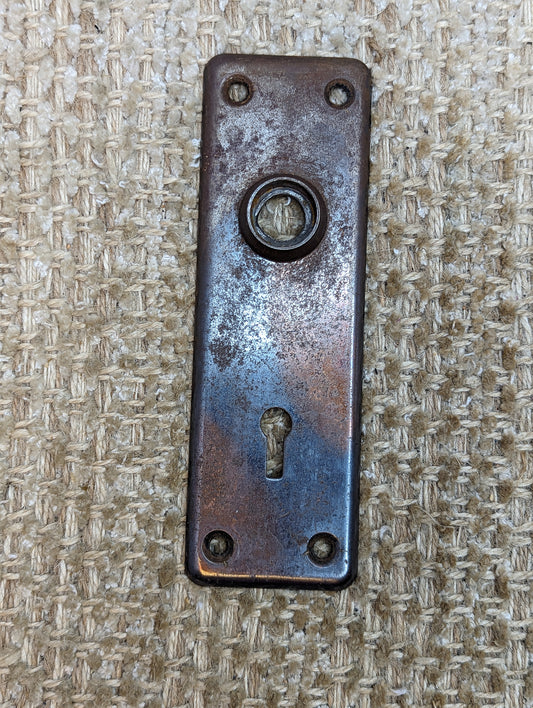 1 13/16" x 5 11/16" Antique Stamped Steel Door Knob Plate