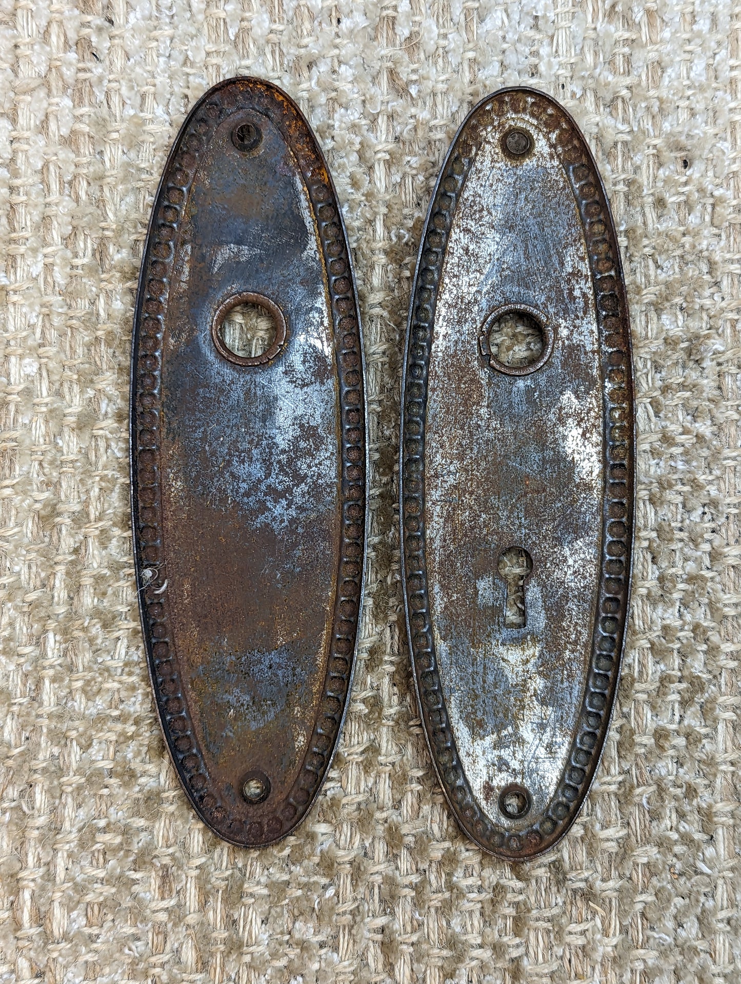 2 1/4" x 7 3/8" Pair Of Antique Stamped Steel Door Knob Plates