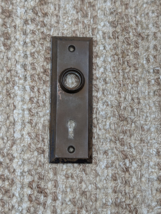 1 1/2" x 4 1/2" Antique Stamped Steel Door Knob Plate