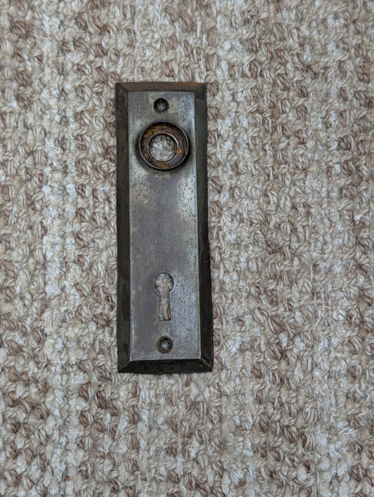 1 1/2" x 4 13/16" Antique Stamped Steel Door Knob Plate