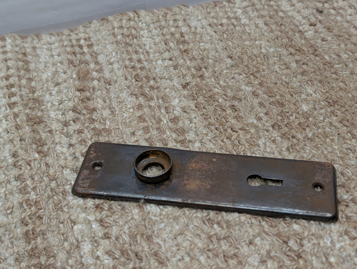 1 5/8" x 5 1/2" Antique Stamped Steel Door Knob Plate