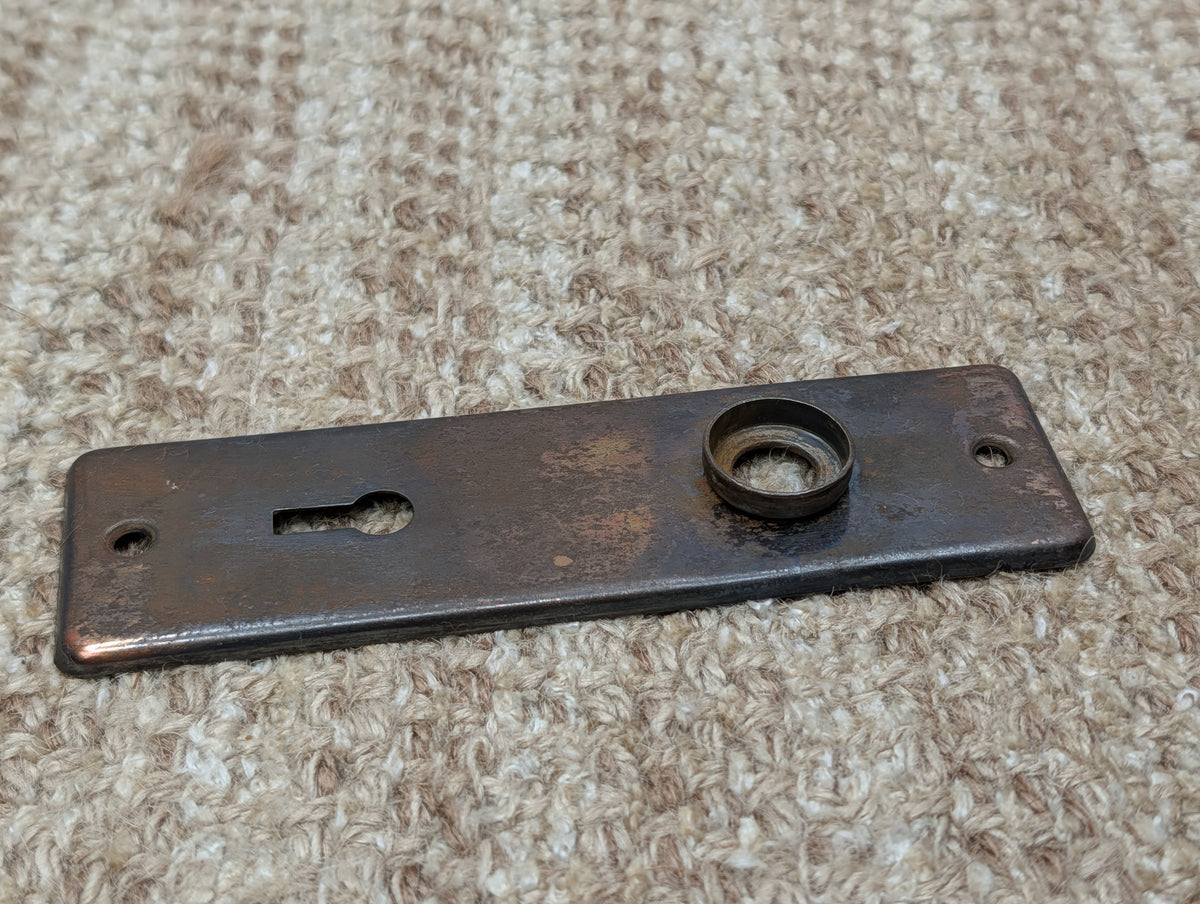 1 5/8" x 5 1/2" Antique Stamped Steel Door Knob Plate