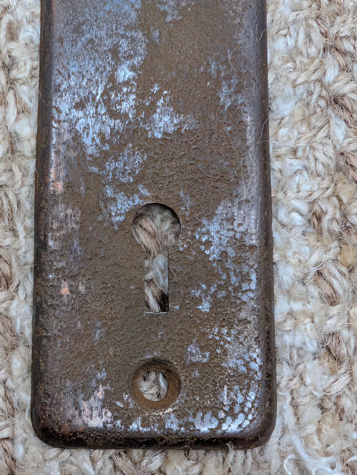 1 5/8" x 5 3/8" Antique Stamped Steel Door Knob Plate