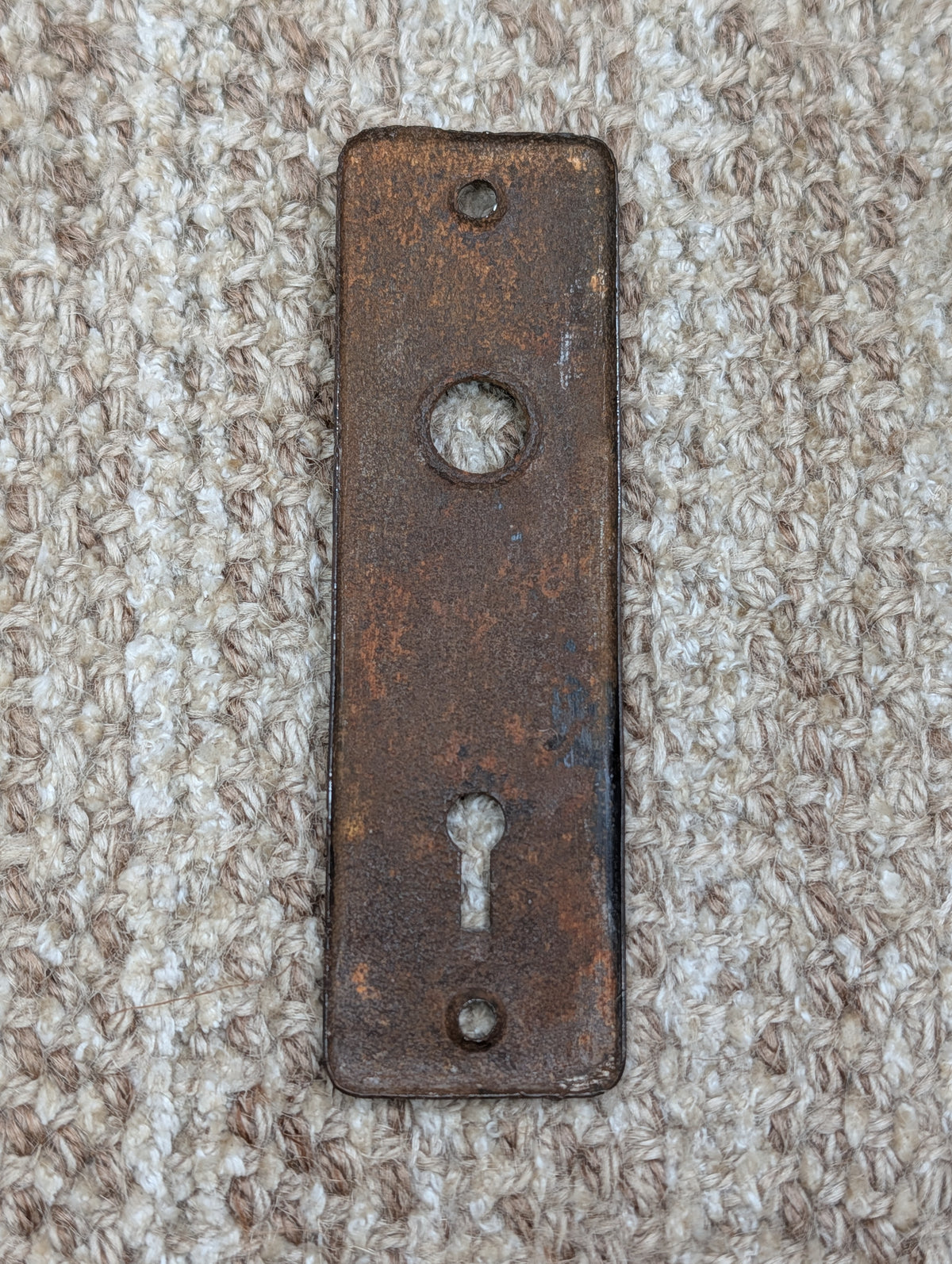 1 5/8" x 5 3/8" Antique Stamped Steel Door Knob Plate