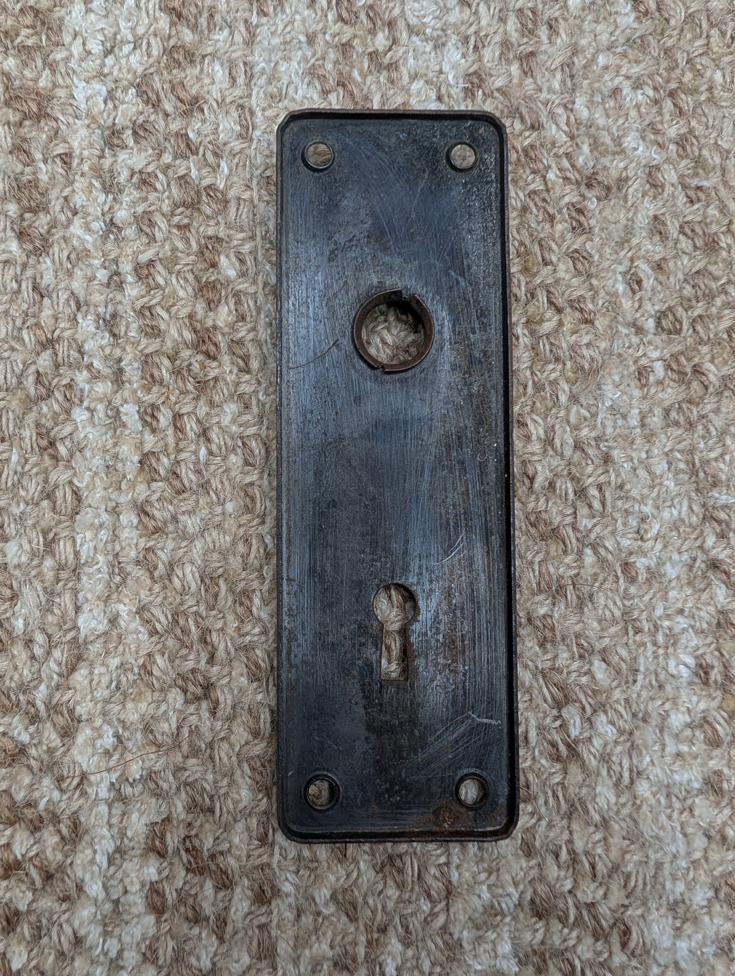 1 13/16" x 5 11/16" Antique Stamped Steel Door Knob Plate