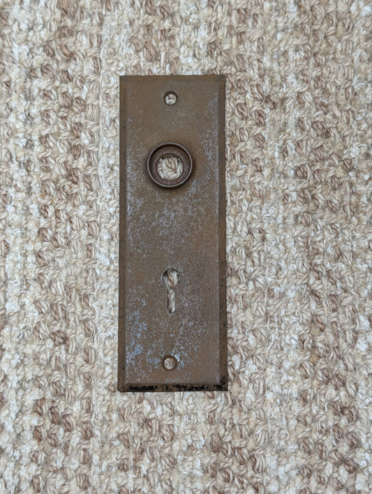 1 13/16" x 5 7/8" Antique Stamped Steel Door Knob Plate