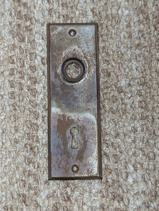 1 13/16" x 5 7/16" Antique Stamped Steel Door Knob Plate