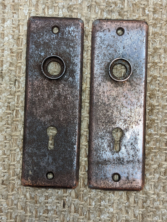 1 15/16" x 5 13/16" Pair Of Antique Stamped Steel Door Knob Plates